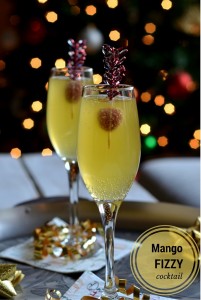 Mango Fizzy Cocktail - A tropical flavored cocktail with mango vodka and sparkling cider to serve for your New Years Party!