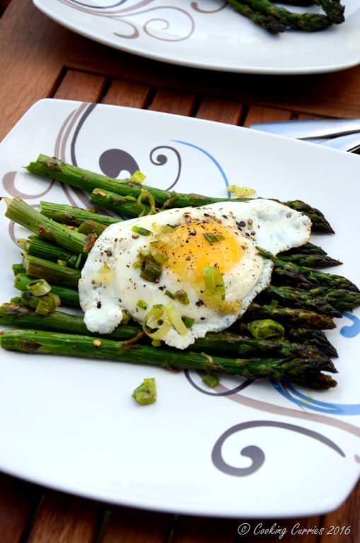 Fried Eggs Over Roasted Asparagus and Green Garlic Herb Butter Sauce