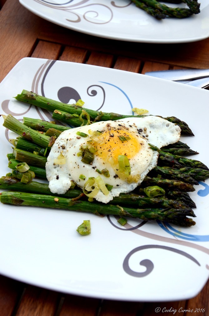 Fried Eggs Over Roasted Asparagus and Green Garlic Herb Butter Sauce