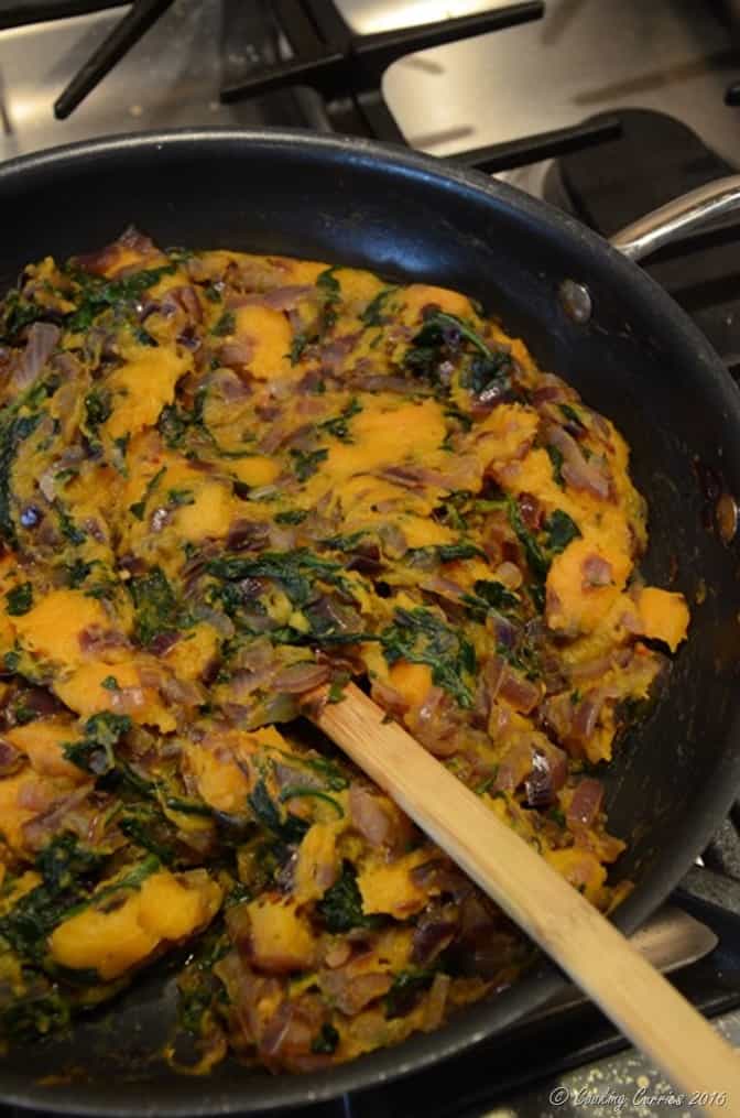 butternut squash and spinach lasagna filling in a pan