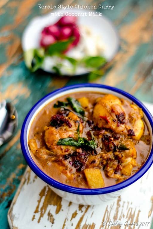 Chicken curry in a blue rimmed white bowl