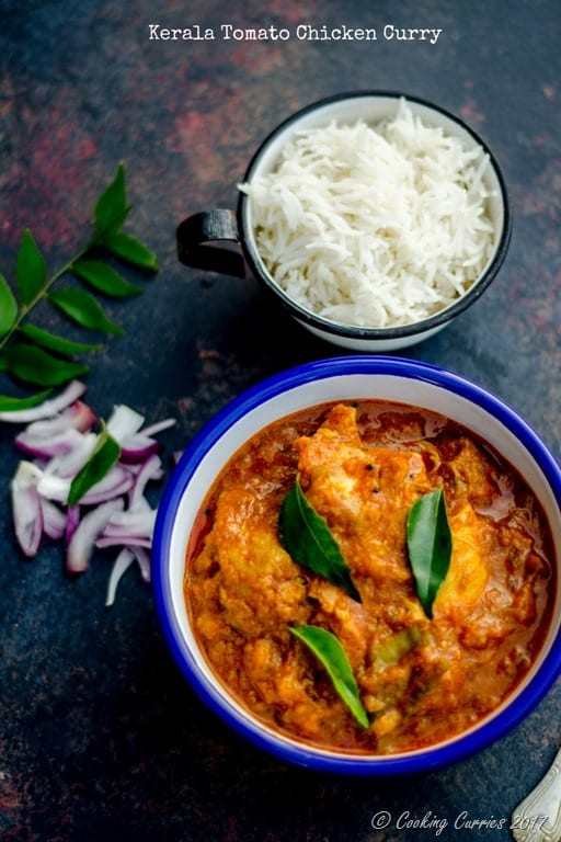 Chicken curry in a blue rimmed white bowl