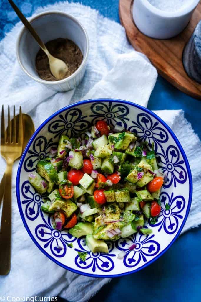 Chopped Cucumber, Avocado, Cherry Tomatoes and Onions as a salad in a bowl