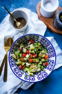 Chopped Cucumber, Avocado, Cherry Tomatoes and Onions as a salad in a bowl