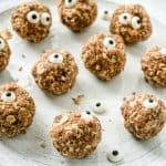 Oatmeal Energy Balls with Candy Eyes, all placed spread out on a white plate