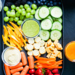 Top shot of a snack platter with rainbow colored snacks in it