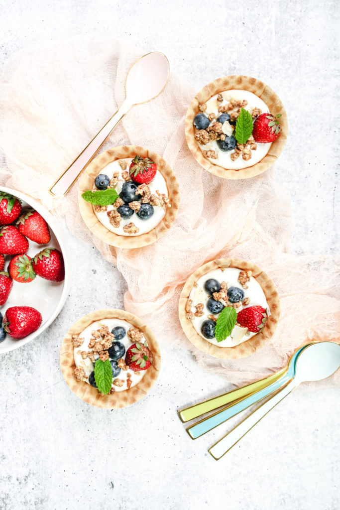 Waffle bowls with yogurt, granola and berries