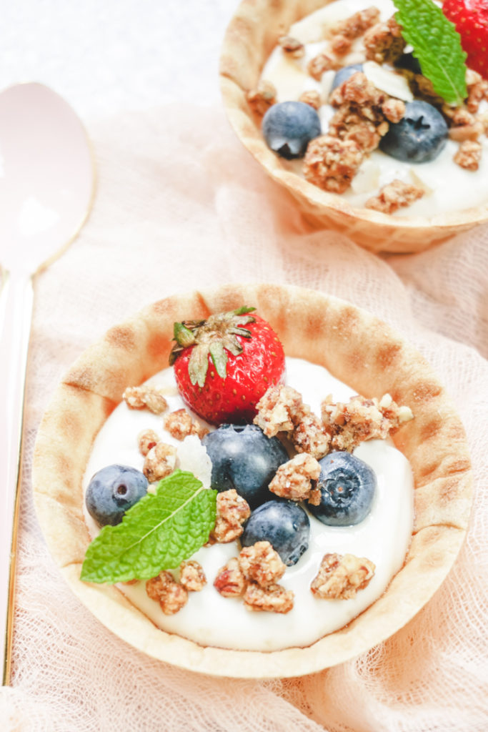 Waffle bowls with yogurt, granola and berries