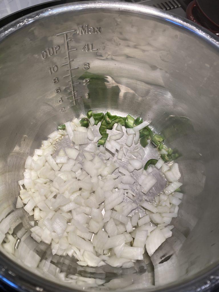 chopped onions and jalapenos in an instant pot