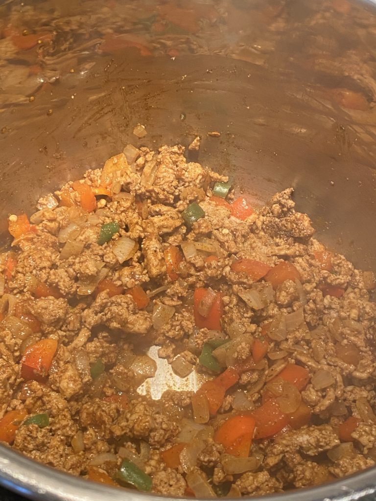 Ground turkey sauteed with peppers and onions in an instant pot
