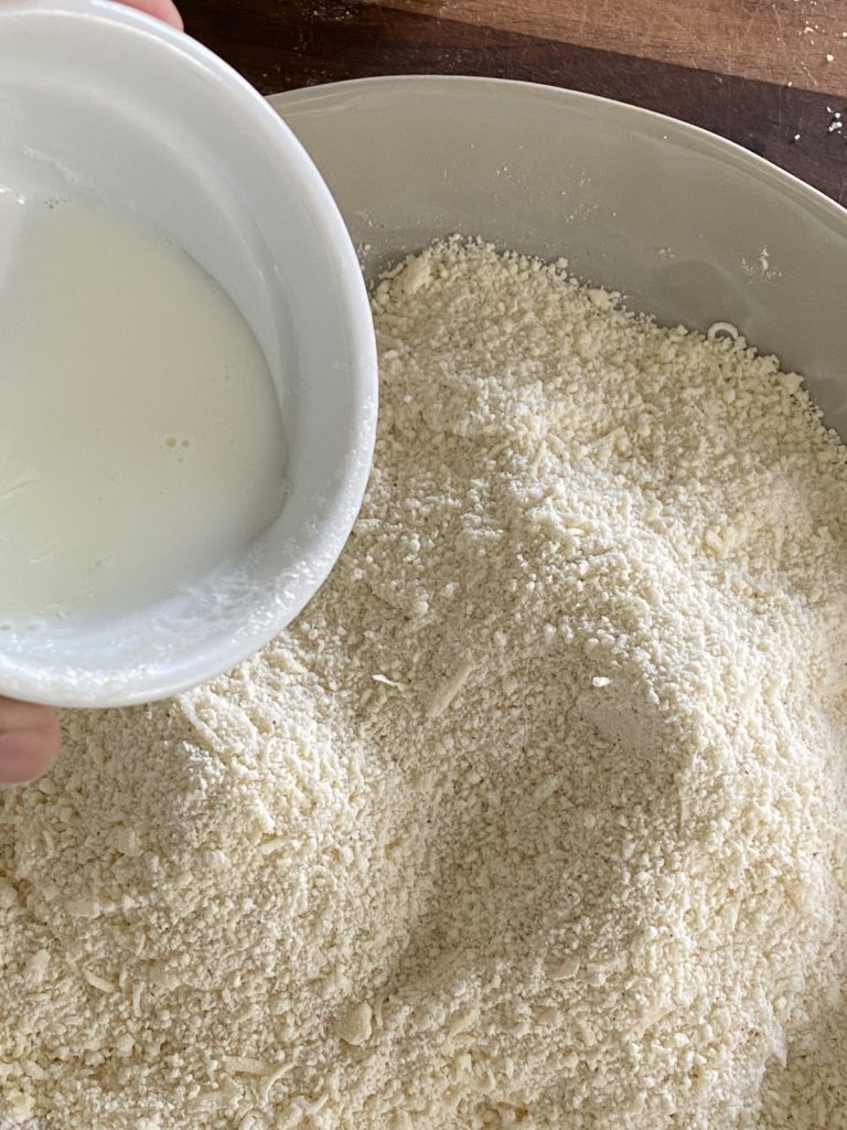 milk being added to the dry ingredients
