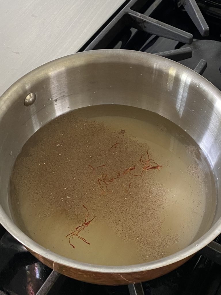 ground cardamom and saffron added to the sugar water