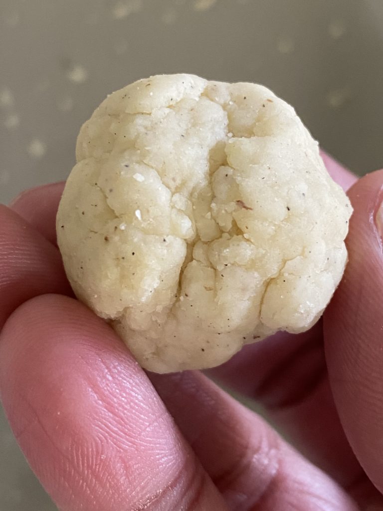gulab jamun dough ball with cracks