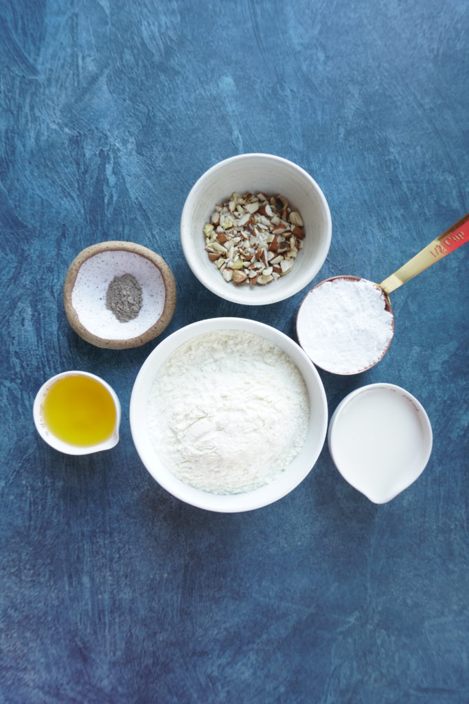 Ingredients set out for the burfi in individual bowls