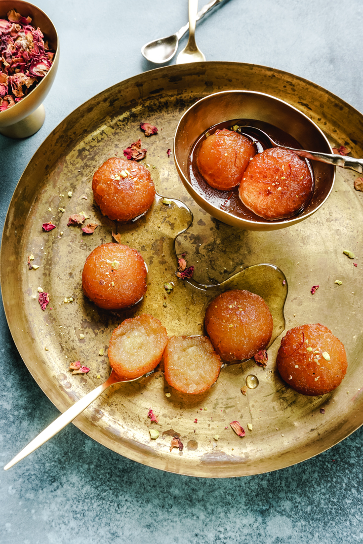 platter with gulab jamun and a bowl with gulab jamun