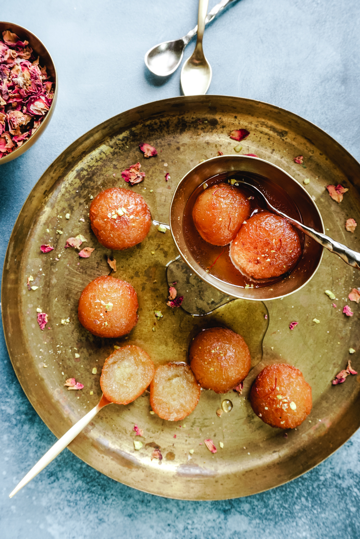 platter with gulab jamun and a bowl with gulab jamun