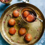 platter with gulab jamun and a bowl with gulab jamun and text on image