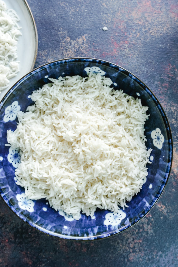 Top shot of cooked basmati rice in a blue bowl