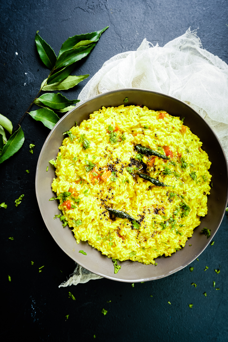 top shot of grey bowl with rasam rice in it