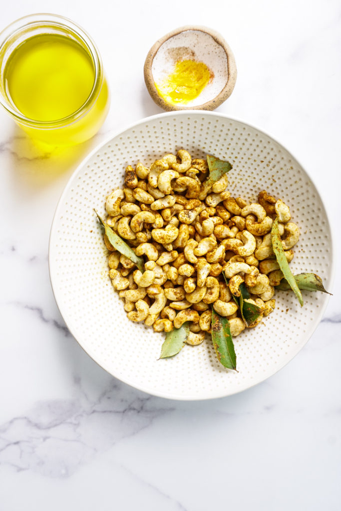 Cashew tossed with spices in a bowl