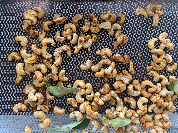 Roasted cashews in the air fryer tray