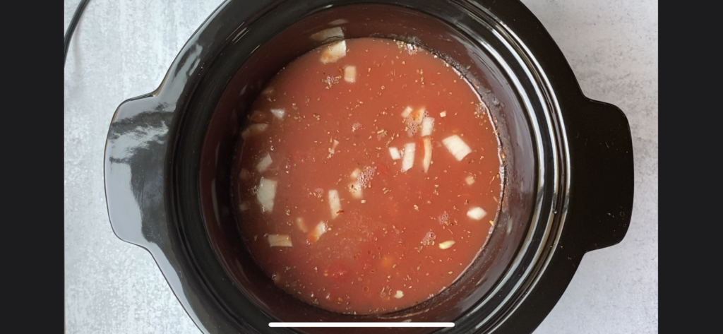 crockpot with stock over tomato base