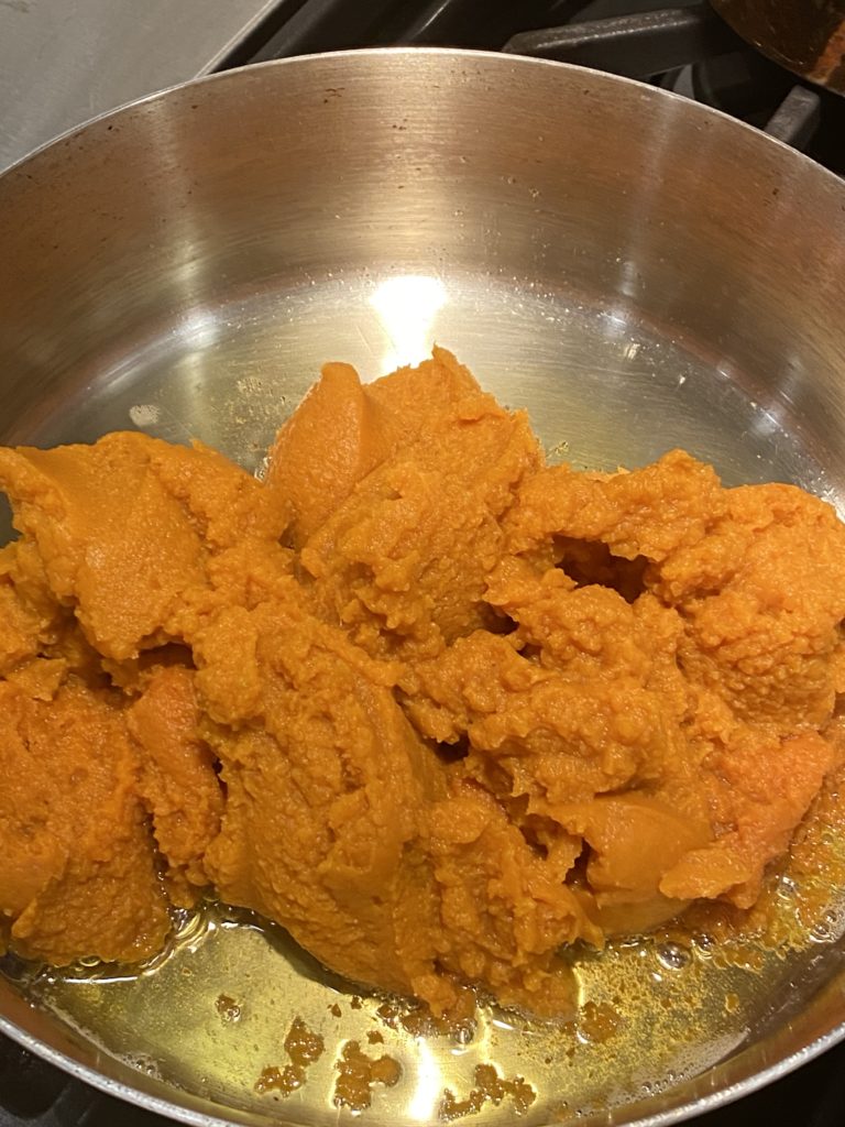 Pumpkin puree in ghee in a pan