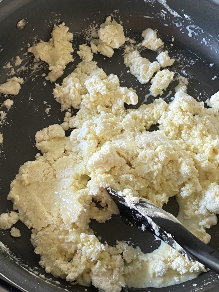 a clumpy mixture of milk powder and milk