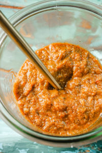 Thai red curry paste in a glass jar