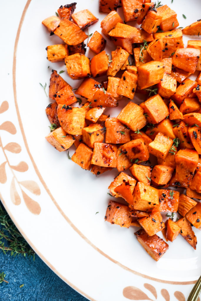 Close up of roasted sweet potatoes in a platter