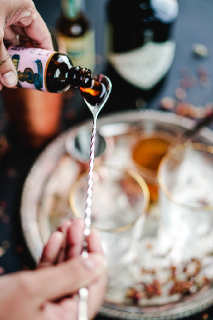 rose syrup poured on to a bar spoon