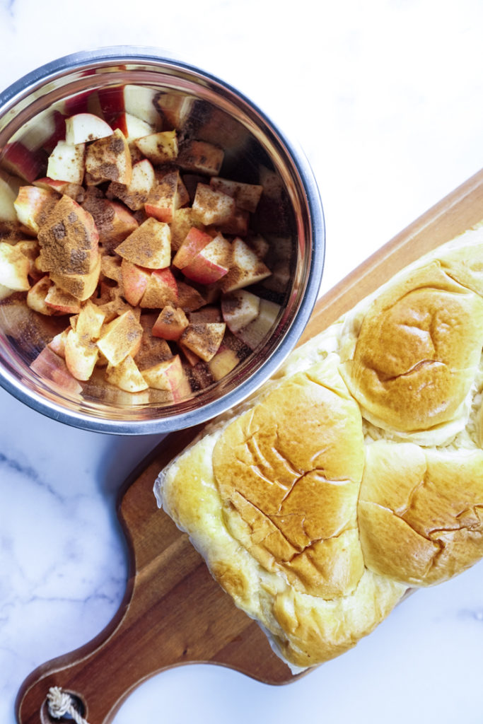 brioche loaf and a bowl of apples with cinnamon and brown sugar