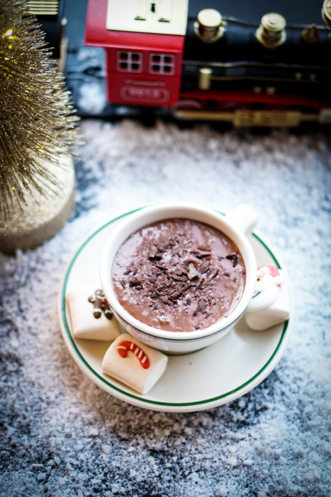 Hot Chocolate in a white cup and saucer with green rim