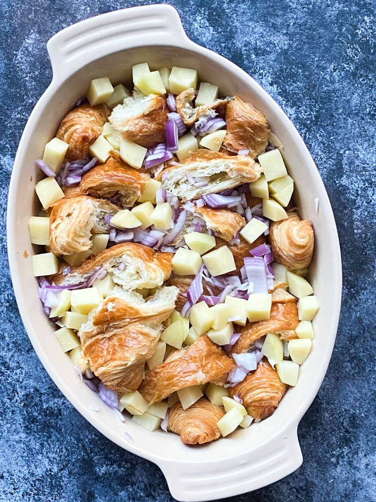 croissant and veggies in a casserole dish