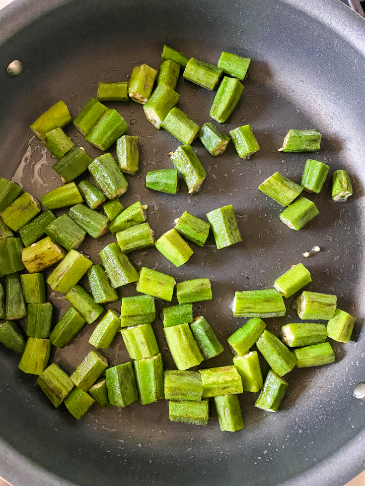 okra sauteeing in a pan