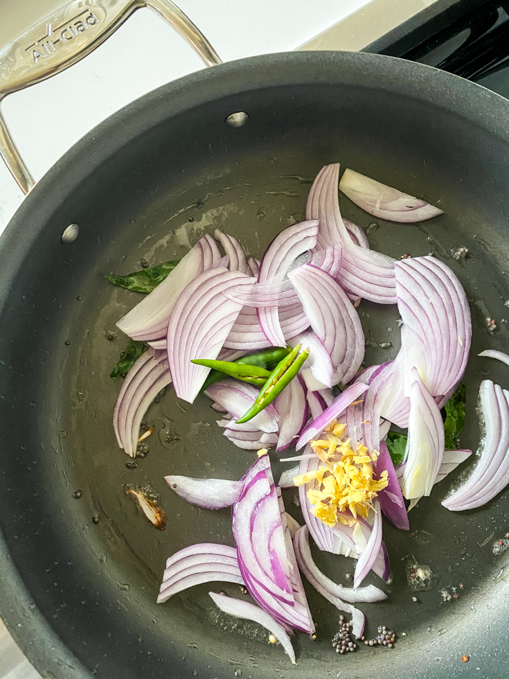 onions, green chillies and ginger in a saute pan