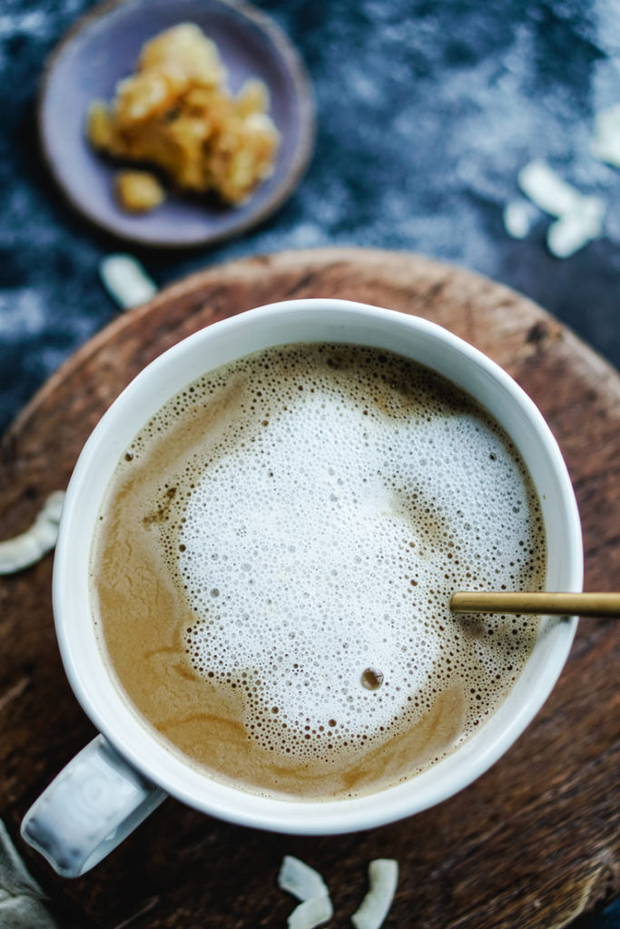 coconut cardamom latte in a white cup