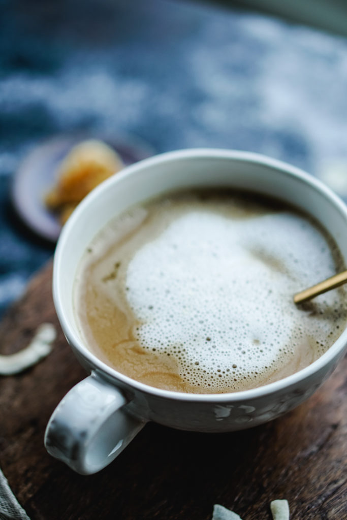 coconut cardamom latte in a white cup