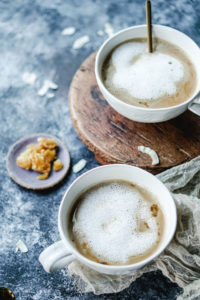 coconut cardamom latte in a white cup