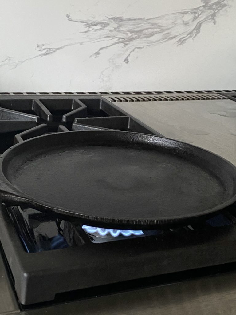 griddle over a lit stove top