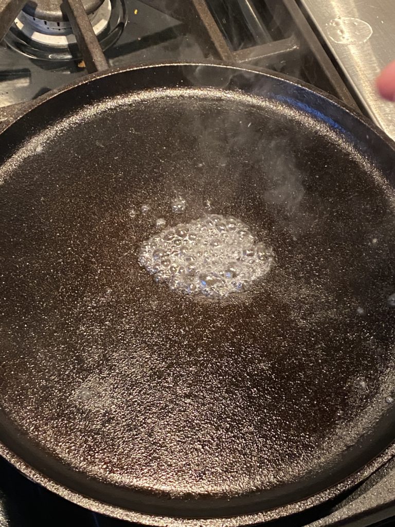 water steaming from a hot griddle