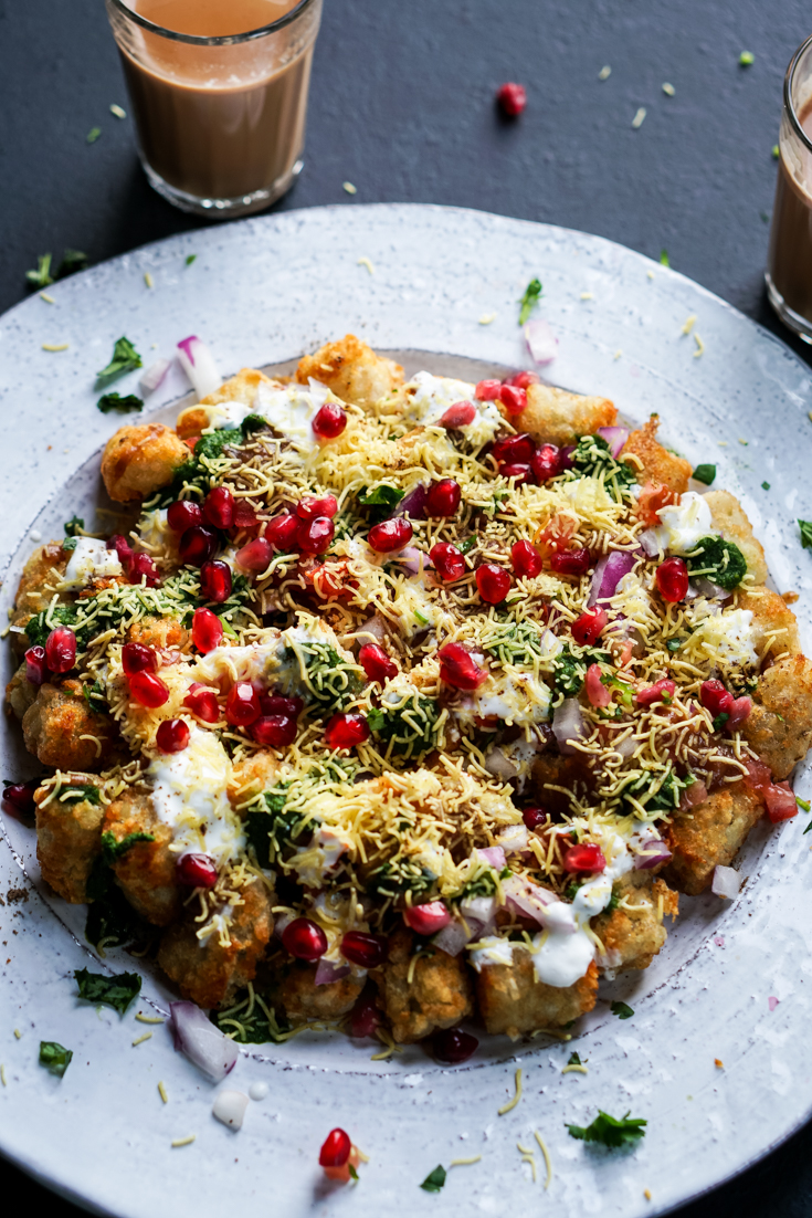 tater tots chaat on a white platter