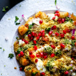 tater tots chaat on a white platter