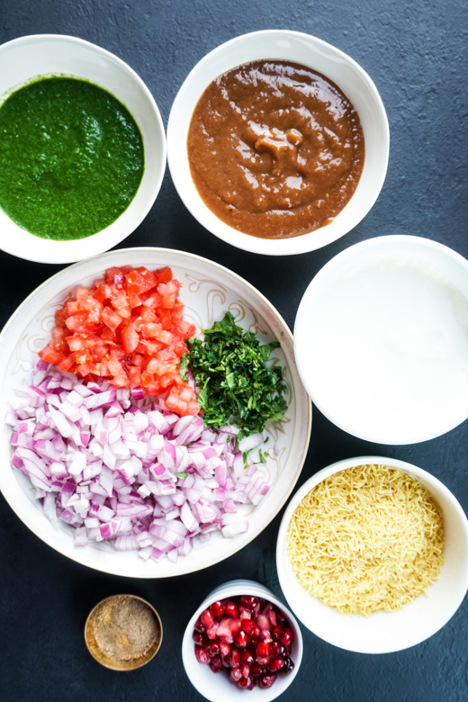 ingredients for tater tots chaat set out in bowls