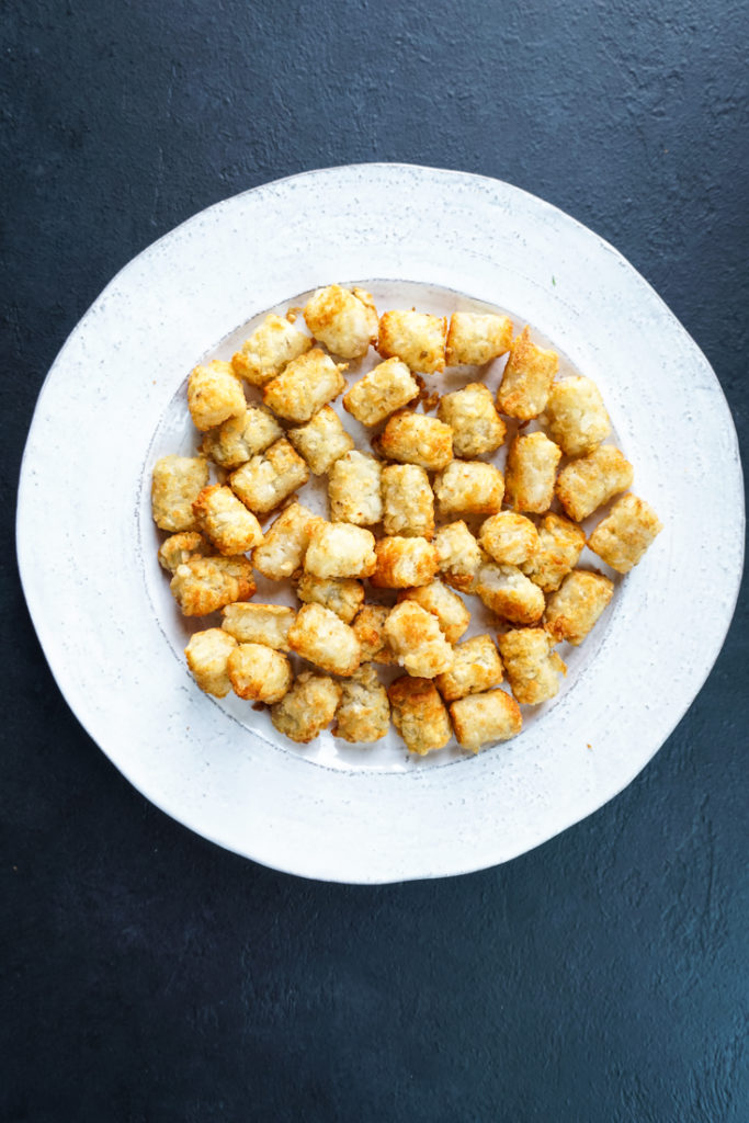 tater tots on a white platter