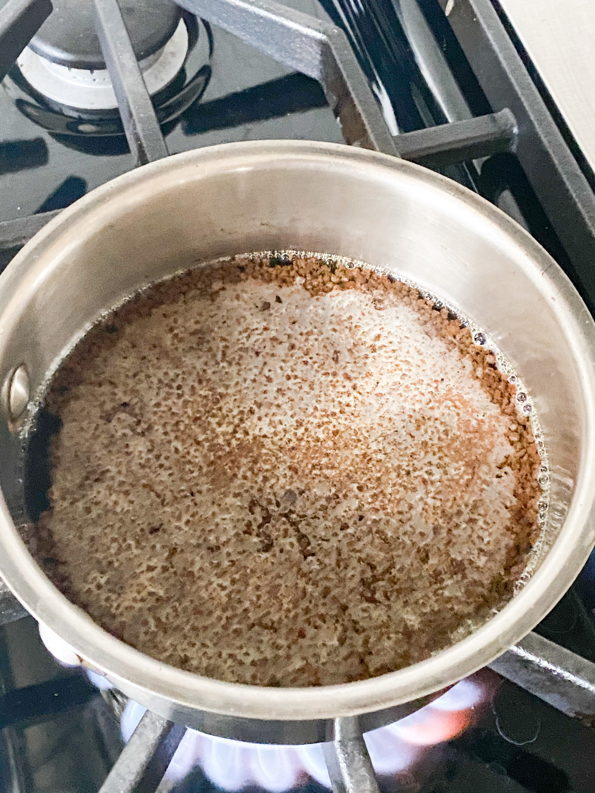 tea leaves and water in a saucepan