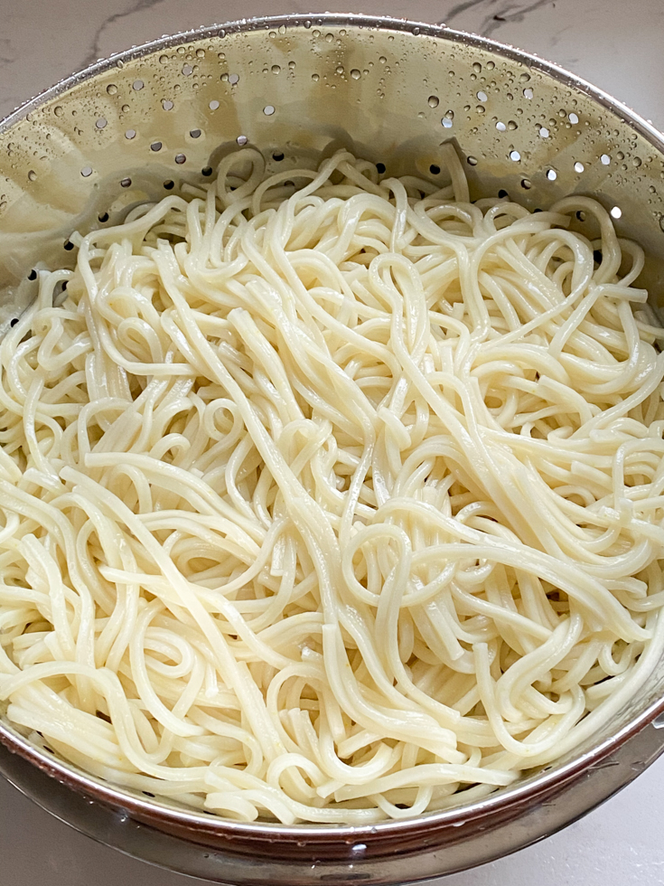 noodles draining in a colander