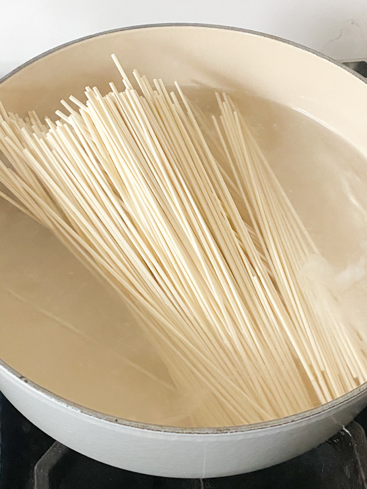 noodles in a pot of boiling water