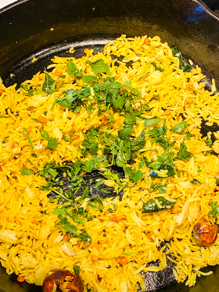 cilantro over lemon rice in a skillet