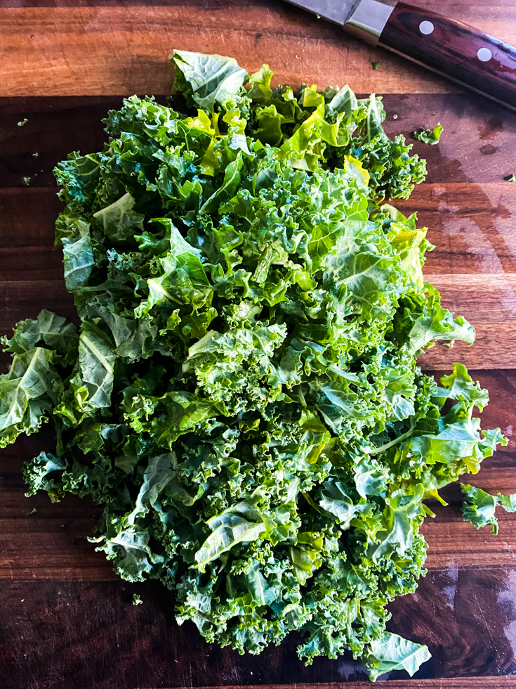 chopped kale on a cutting board